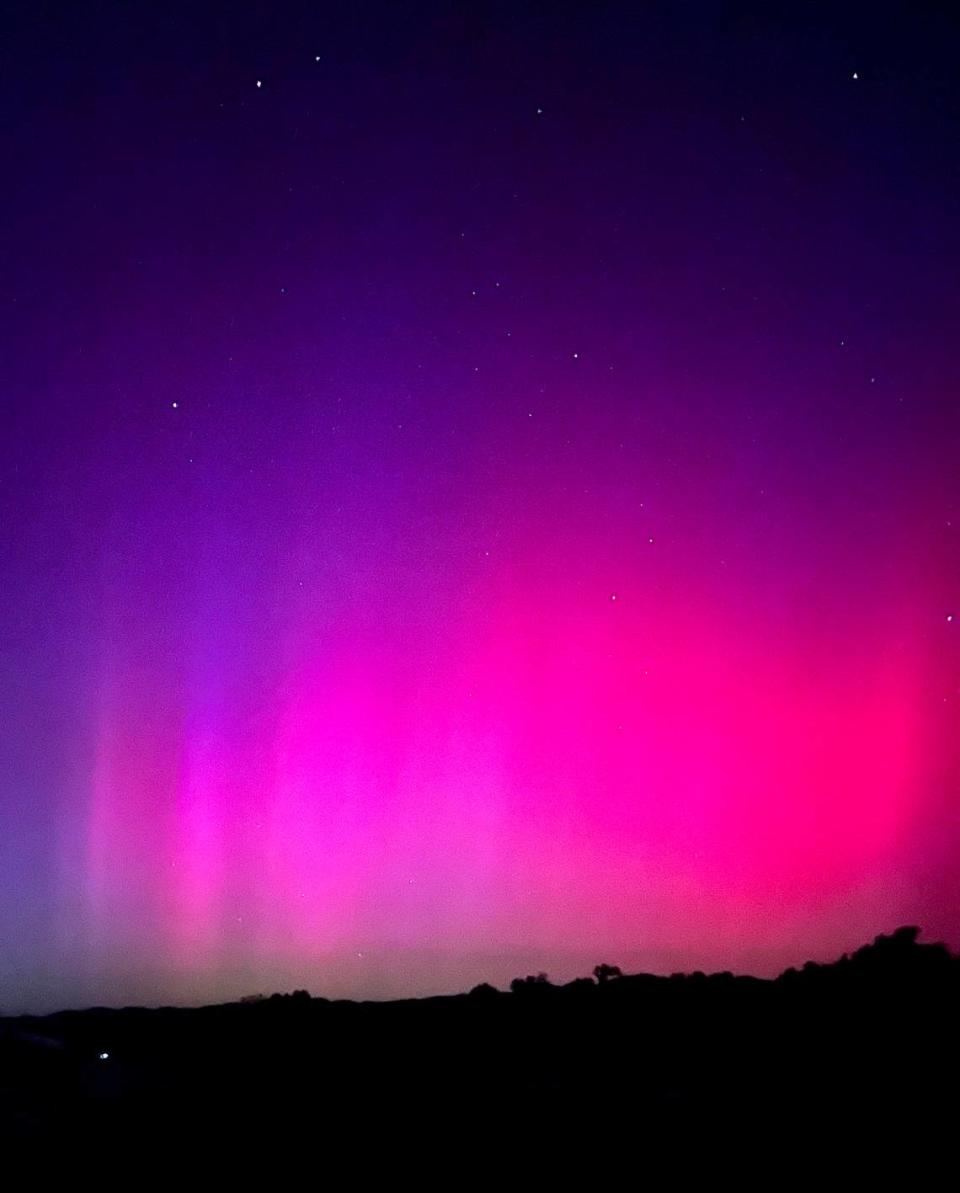 The northern lights illuminate the skies over Santa Margarita in pinks and purples on May 10, 2024.