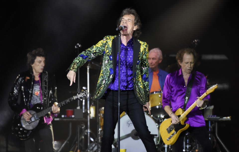 Mick Jagger, center, performs with his Rolling Stones bandmates, from left, Ron Wood, Charlie Watts and Keith Richards at the Rose Bowl, Thursday, Aug. 22, 2019, in Pasadena, Calif. (Photo by Chris Pizzello/Invision/AP)