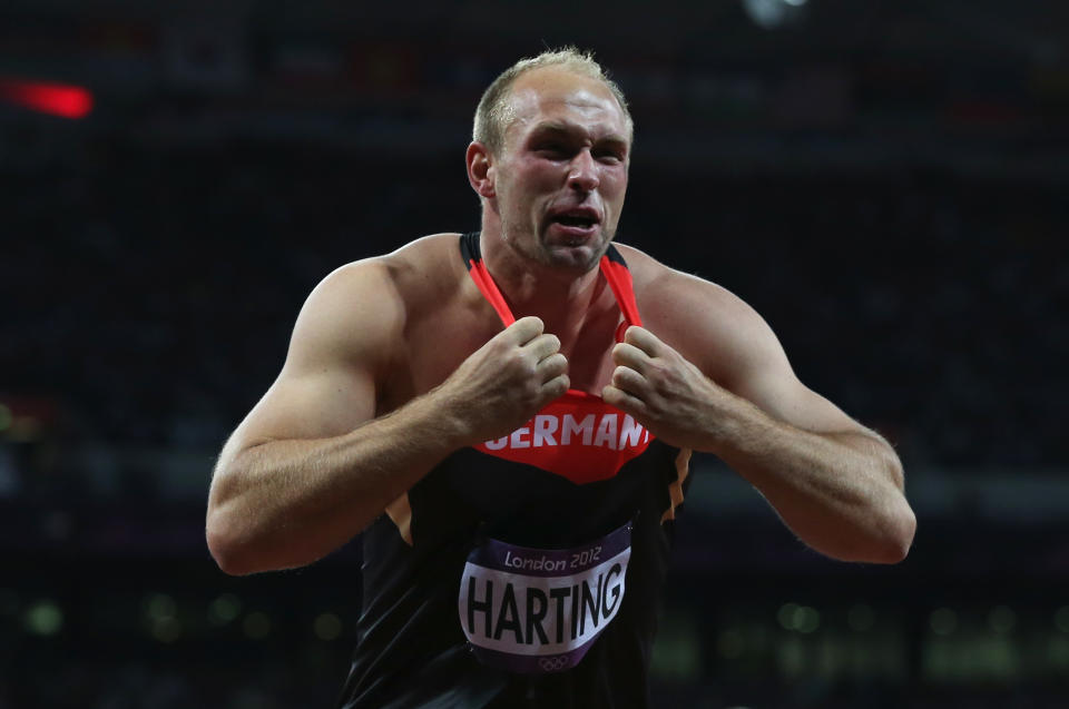 German Robert Harting celebrates winning discus gold like "Real American" Hulk Hogan celebrates winning Royal Rumble. (Photo by Quinn Rooney/Getty Images)