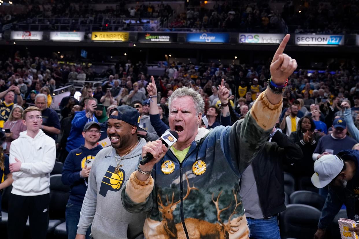 Actor Will Ferrell shouts to fans before an NBA basketball game between the Indiana Pacers and the Philadelphia 76ers, Monday  in Indianapolis.