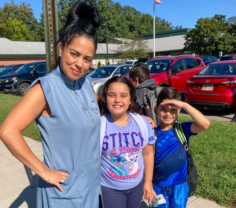 Jacquelyn Louzda dropped off her children, Sophia and Guilherme, Thursday at Northwest Elementary School. All city schools were closed Tuesday and Wednesday because of citywide damage caused by Monday's storm.