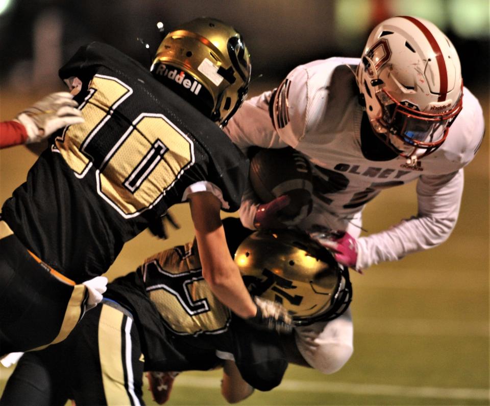 Olney's Jovani Rockmore is tackled by the Archer City defense on Friday, October 29, 2021 in Archer City.