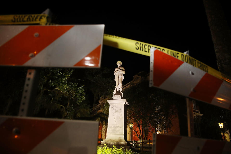 <p>Barricades surround the Confederate monument in front of the Hernando County Courthouse to keep possible protesters away from the statue in the midst of a national controversy over whether Confederate symbols should be removed from public display on August 18, 2017 in Brooksville, Fla. (Photo: Joe Raedle/Getty Images) </p>