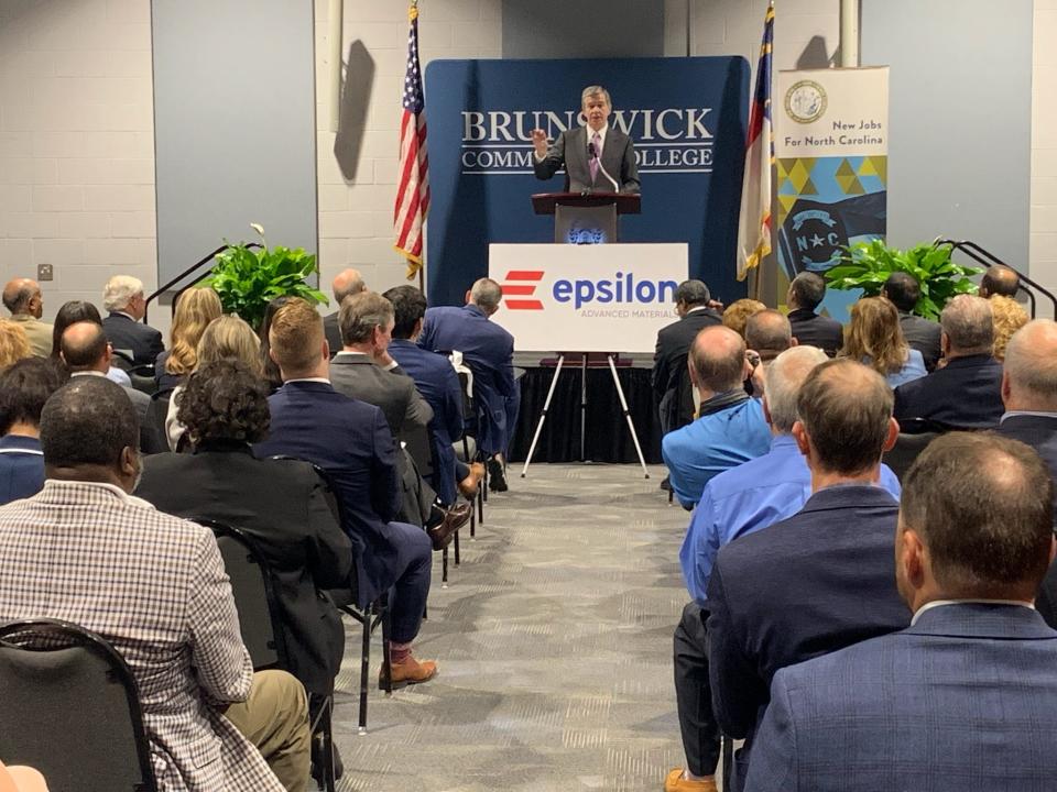 Gov. Roy Cooper announces Epilson Advanced Materials will build an electric vehicle battery plant in Brunswick County during a news conference Thursday at Brunswick Community College.