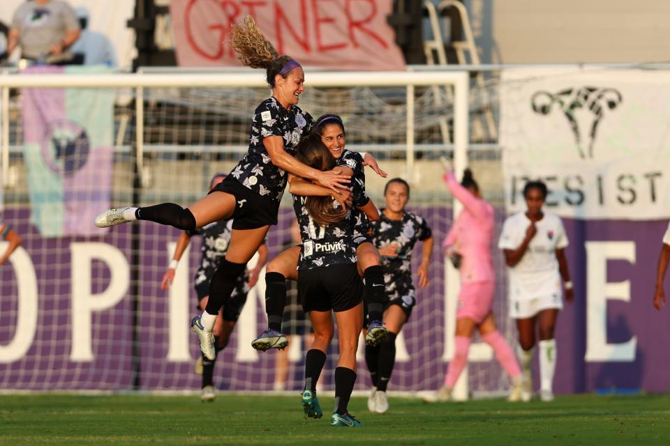 May 18, 2022; Louisville, Kentucky, USA; Racing Louisville FC player Savannah Demelo (7) and team mates celebrate a goal against the San Diego Wave FC during the first half at Lynn Family Stadium. Mandatory Credit: EM Dash-USA TODAY Sports