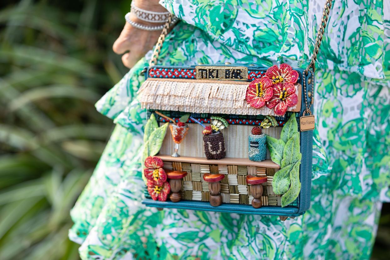 For Curetivity's 2022 Polynesian-themed party, Peggy Johnston's purse was a little tiki bar, complete with tiny tropical drinks.  The 2025 event will be Feb. 6 at the Mar-a-Lago Club.