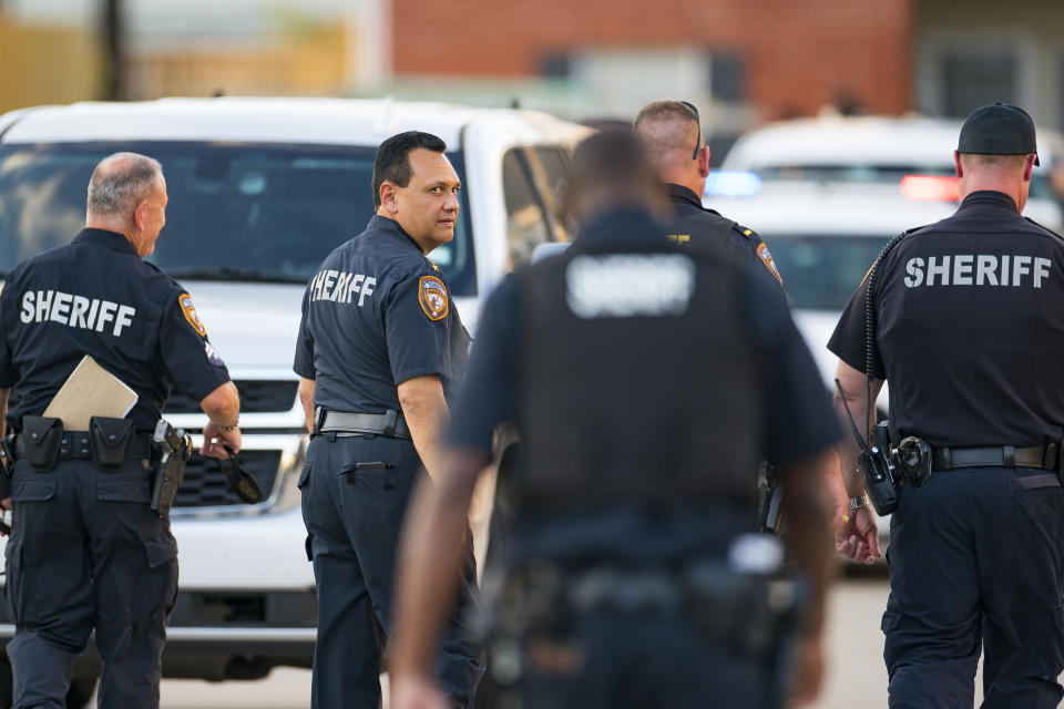 Harris County Sheriff Ed Gonzalez walks back to the scene where three juveniles were found living alone along with the skeletal remains of another person. Source: Mark Mulligan/Houston Chronicle via AP