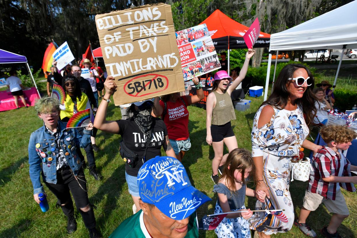 Protesters wrap up their march in Jacksonville, Florida's Riverside Park to bring attention to the changes in Florida's laws that are expected to have negative effects on the state's migrant population, the LGBTQ community, access to abortion and voting rights for citizens. The rally was held with others coordinated around the state.