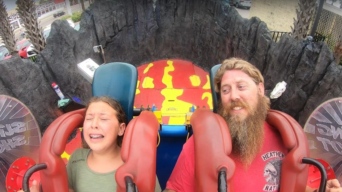 Young girl terrified by slingshot ride