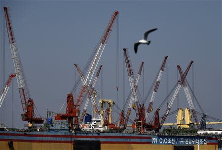 A seagull flies over the dock of C.C shipyard Co.Ltd, which refurbished South Korean ferry Sewol in 2012 by adding space and weight to the vessel, in Yeongam April 22, 2014. REUTERS/Kim Kyung-Hoon