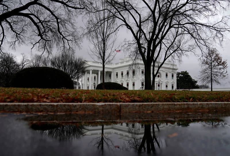 FILE PHOTO: The White House is reflected in a puddle in Washington