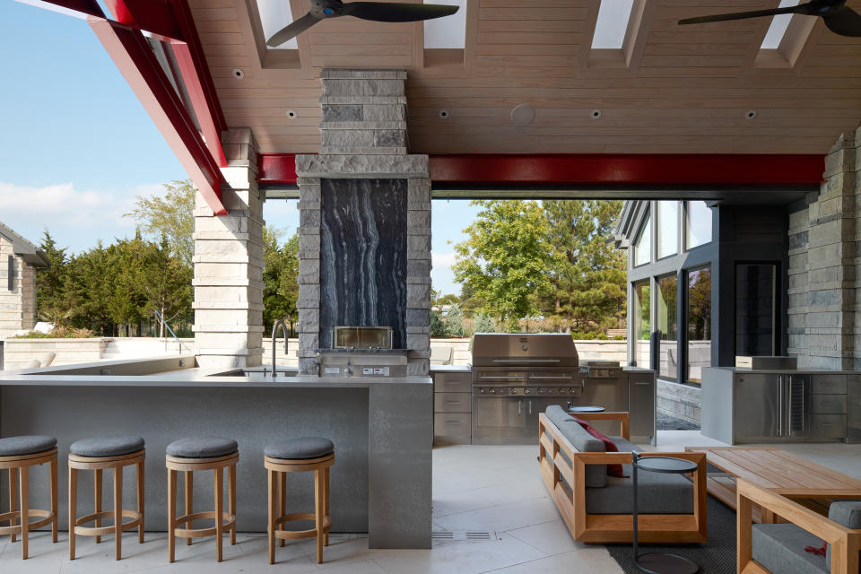 An outdoor dining with kitchen and livign room