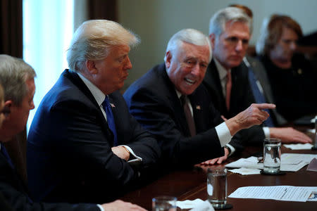 U.S. President Donald Trump, flanked by U.S. Representative Steny Hoyer (D-MD), House Majority Leader Kevin McCarthy (R-CA) and Senator James Lankford (R-OK), holds a bipartisan meeting with legislators on immigration reform at the White House in Washington, U.S. January 9, 2018. REUTERS/Jonathan Ernst