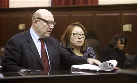 Kyung Chun Yun (R), appears in Manhattan Criminal Court in New York January 30, 2014. REUTERS/Jefferson Siegel/Pool