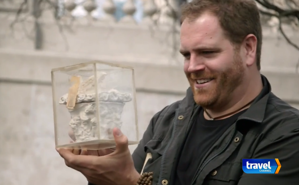 Josh Gates clearly admired the ceramic casque that was dug up.