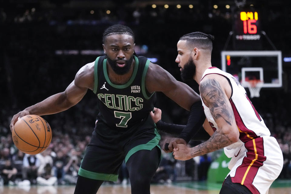 Boston Celtics guard Jaylen Brown (7) sets to drive against Miami Heat forward Caleb Martin during the first half of Game 5 of an NBA basketball first-round playoff series, Wednesday, May 1, 2024, in Boston. (AP Photo/Charles Krupa)