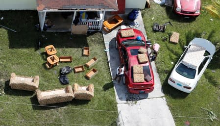 Residents dry belongings after hurricane Dorian hit the Grand Bahama Island in the Bahamas