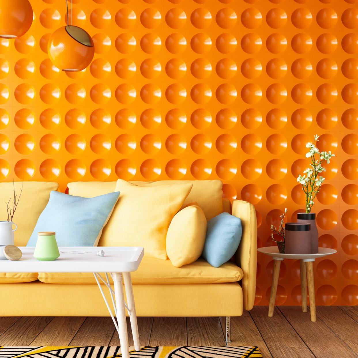 colorful sofa with geometric orange wall