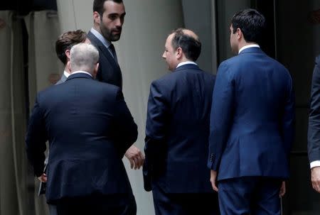 Chairman of the Republican National Committee Reince Priebus (C) arrives at the Le Cirque restaurant with others for a fundraising event for Republican presidential candidate Donald Trump in Manhattan, New York City, U.S., June 21, 2016. REUTERS/Mike Segar