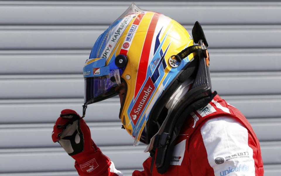 Ferrari Formula One driver Fernando Alonso of Spain is pictured after the qualifying session of the Italian F1 Grand Prix at the Monza circuit September 7, 2013. Alonso qualified fifth. REUTERS/Stefano Rellandini (ITALY - Tags: SPORT MOTORSPORT F1)