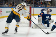 Nashville Predators left wing Kiefer Sherwood (44) shoots against New York Islanders goaltender Semyon Varlamov (40) during the first period of an NHL hockey game in Elmont, N.Y., Saturday, April 6, 2024. (AP Photo/Peter K. Afriyie)