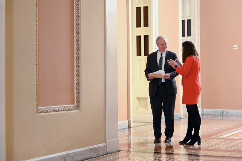 Sen. Van Hollen goes over his notes during a break in the impeachment trial of President Trump