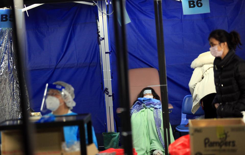 A child recovers from COVID-19 in a makeshift hospital ward in Hong Kong.