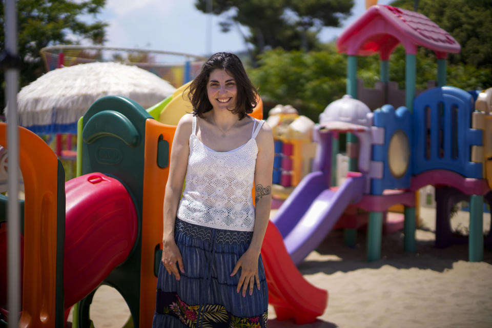 Branding strategist Federica Nobile poses at the beach of Roseto Degli Abruzzi, near Teramo in central Italy, Saturday, June 3, 2023. Like many young Italians, she was raised in a devout family and now defines herself as “Catholic but not too much.” (AP Photo/Domenico Stinellis)