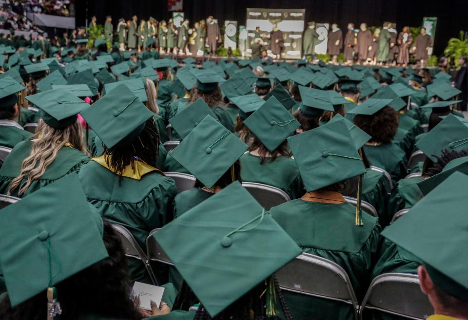 George Jenkins grads watch their classmates walk across the state during graduation ceremonies in Lakeland in May.