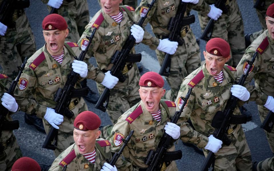 Russian soldiers march toward Red Square to attend a Victory Day military parade in Moscow, Russia