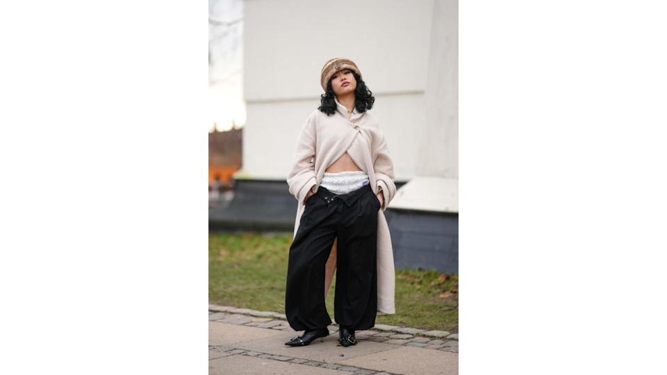 Ruffled silky bloomers beneath baggy jeans is a perfect pairing in Copenhagen. 