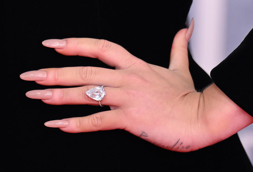 LONDON, ENGLAND - FEBRUARY 08: (EDITORIAL USE ONLY) Adele, ring detail, attends The BRIT Awards 2022 at The O2 Arena on February 08, 2022 in London, England. (Photo by Karwai Tang/WireImage)