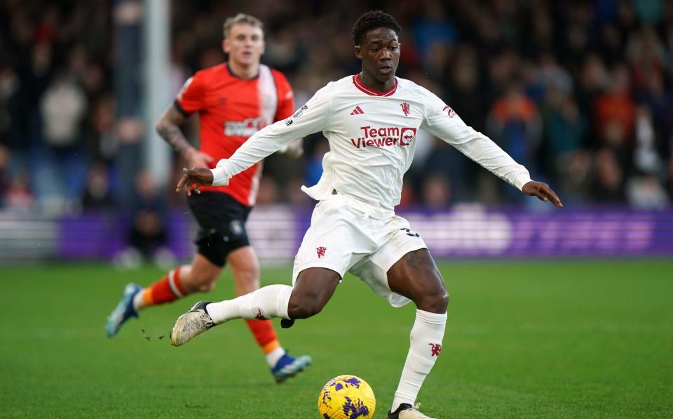 Manchester United's Kobbie Mainoo in action during the Premier League match at Kenilworth Road