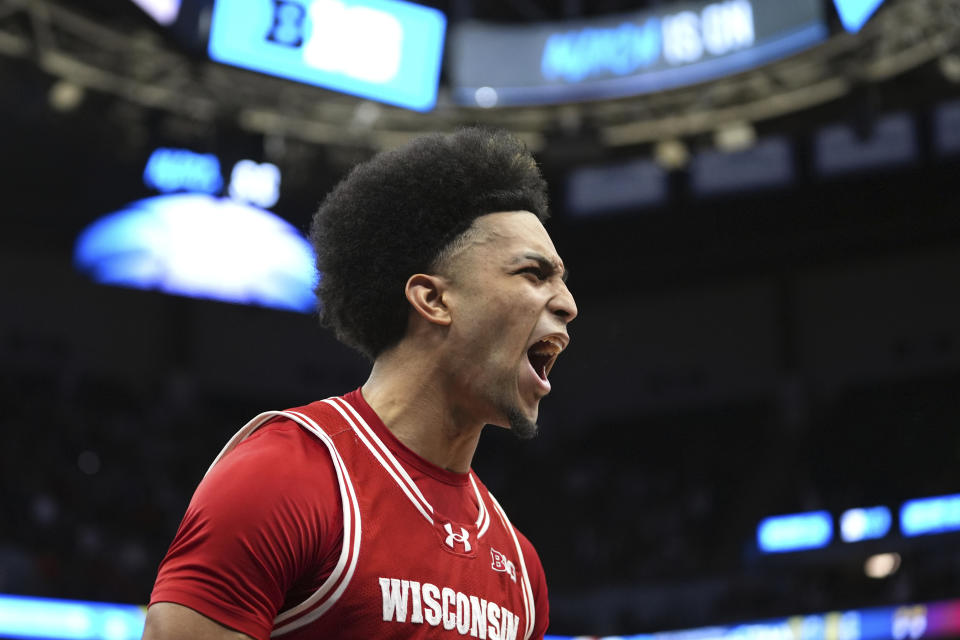 Wisconsin guard Chucky Hepburn (23) celebrates after scoring to force overtime late in the second half of an NCAA college basketball game against Purdue in the semifinal round of the Big Ten Conference tournament, Saturday, March 16, 2024, in Minneapolis. (AP Photo/Abbie Parr)