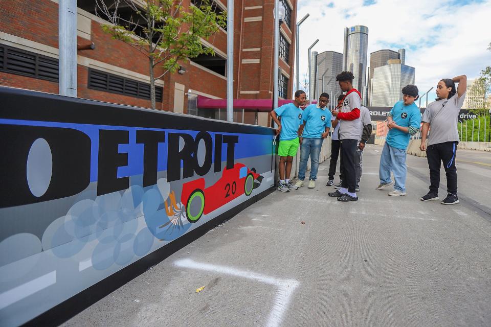 Students from the Boys and Girls Cubs of Southeastern Michigan check out the murals they made that will be displayed trackside during the Grand Prix, May 31-June 2, at a press conference near the finish line in Detroit on Wed., May 1, 2024.