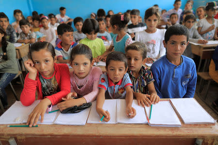 Children attend their first class immediately after they got registered at the school in Hazema North Raqqa, Syria August 21, 2017. Picture taken August 21, 2017. REUTERS/Zohra Bensemra