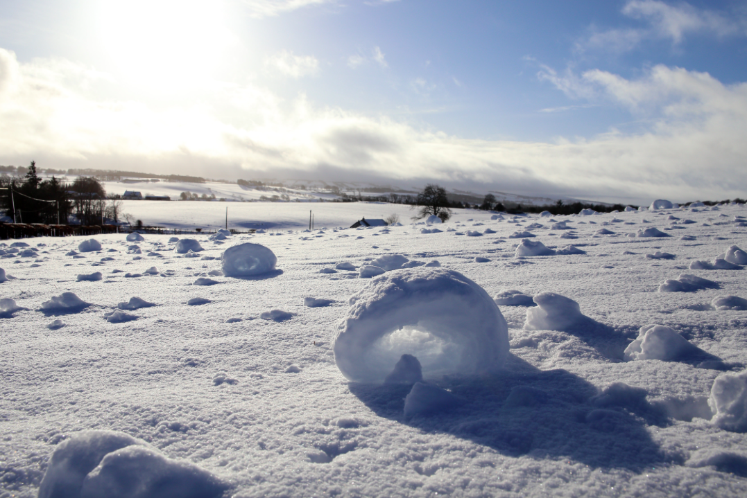 <em>Snow rollers are a rare weather phenomenon consisting of naturally-made snowballs (SWNS)</em>