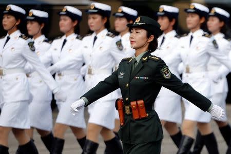 Troops prepare for the arrival of Chinese President Xi Jinping (unseen) at the People's Liberation Army (PLA) Hong Kong Garrison in one of events marking the 20th anniversary of the city's handover from British to Chinese rule, in Hong Kong, China June 30, 2017. REUTERS/Damir Sagolj