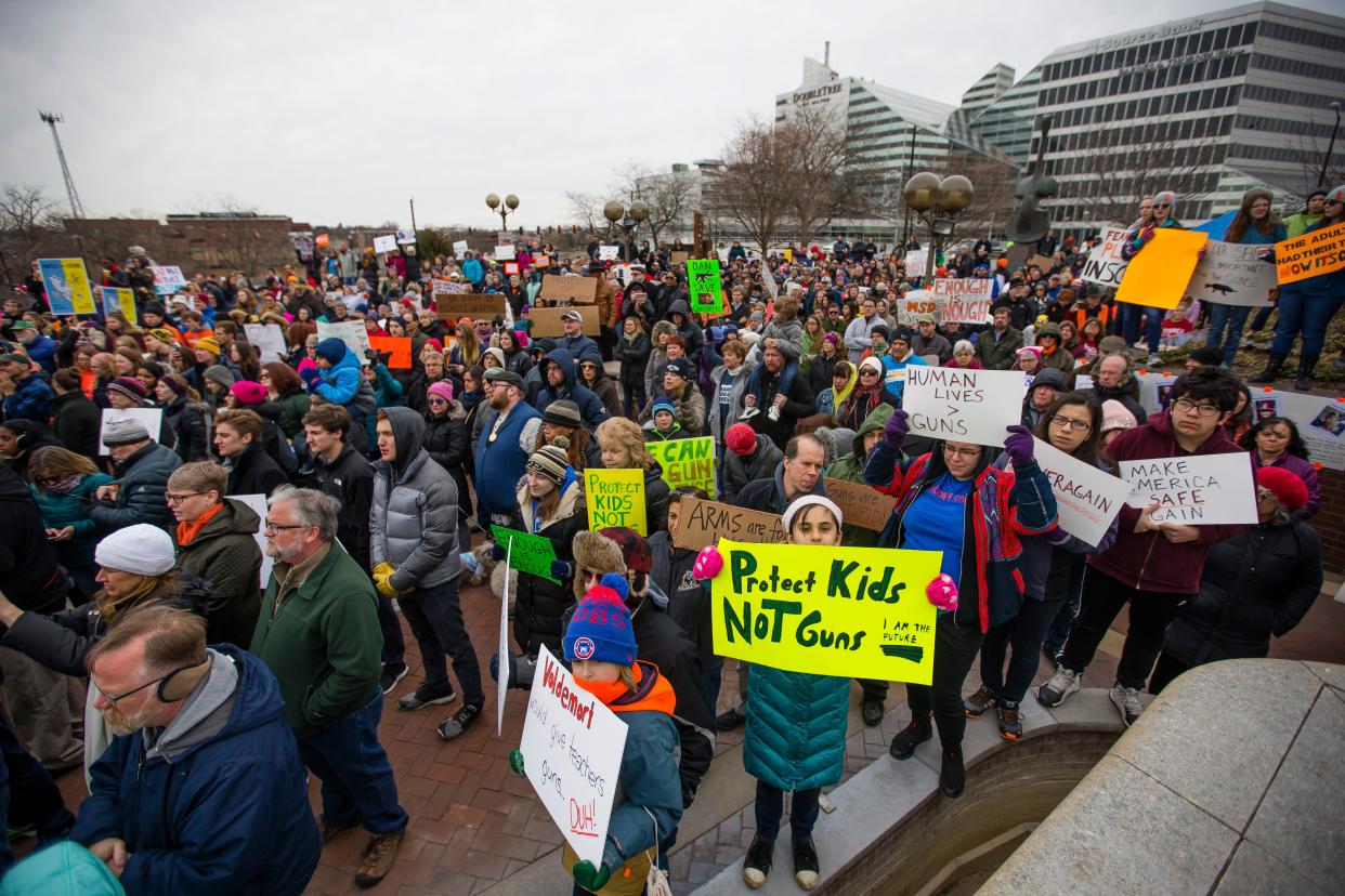 In this file photo, attendees hold signs March 24, 2018, during the March for Our Lives event in downtown South Bend. South Bend Tribune File Photo/MICHAEL CATERINA