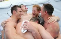 <p>Gold medalists at the 2016 Invictus Games, an international competition for wounded soldiers, celebrated with the event's patron, Prince Harry. </p>