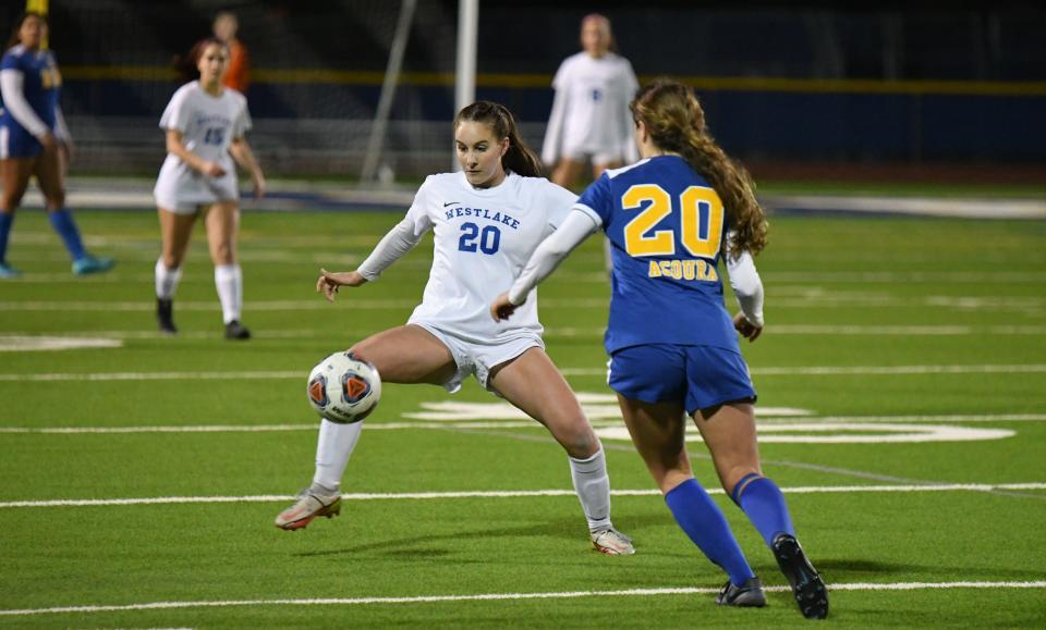 Westlake's Tatum Wynalda tries to control the ball while being defended by Agoura's EmmaJane Kennedy during the teams' 1-1 draw in a Marmonte League match this season.