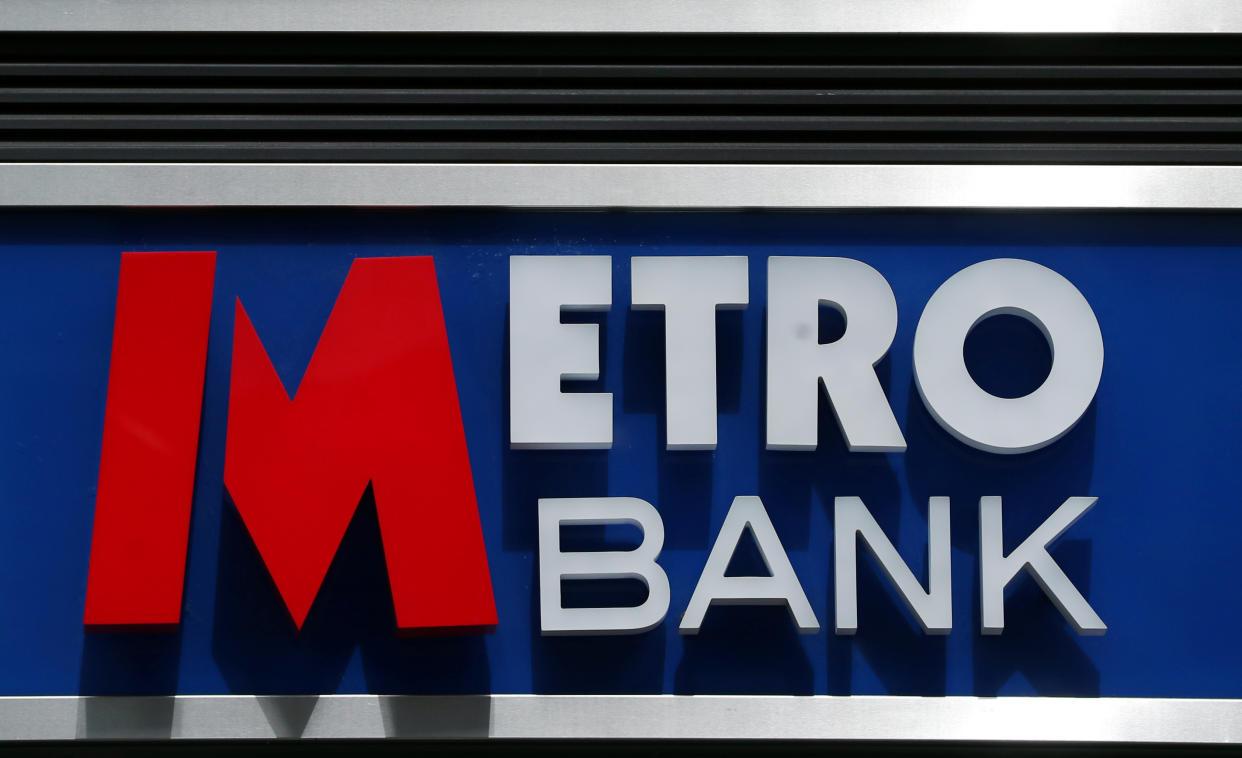 Signage is seen outside of a Metro Bank in London