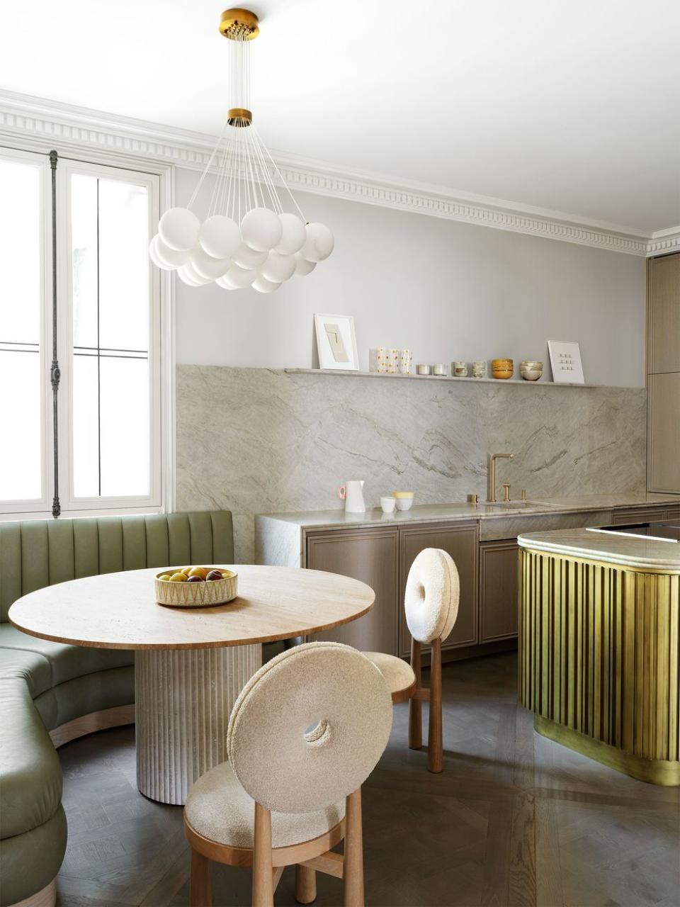 a kitchen with a table and chairs