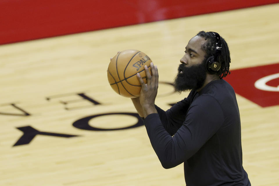 Houston Rockets' James Harden warms up prior to facing the San Antonio Spurs in an NBA basketball game in Houston, Thursday, Dec. 17, 2020. (Carmen Mandato/Pool Photo via AP)