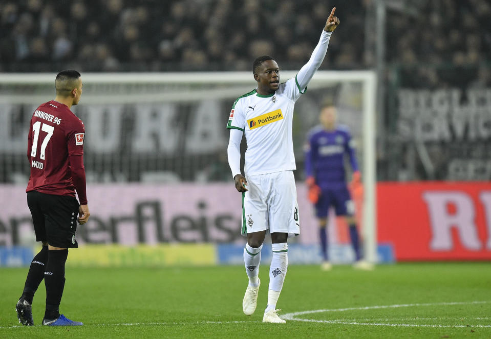 Moenchengladbach's scorer Denis Zakaria, right, celebrates his side's 4th goal beside Hannover's Bobby Wood, left, during the German Bundesliga soccer match between Borussia Moenchengladbach and Hannover 96 at the Borussia Park in Moenchengladbach, Germany, Sunday, Nov. 25, 2018. (AP Photo/Martin Meissner)