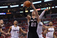 LOS ANGELES, CA - MAY 20: Tiago Splitter #22 of the San Antonio Spurs goes up for a layup in front of Blake Griffin #32 of the Los Angeles Clippers in the first quarter in Game Four of the Western Conference Semifinals in the 2012 NBA Playoffs on May 20, 2011 at Staples Center in Los Angeles, California. NOTE TO USER: User expressly acknowledges and agrees that, by downloading and or using this photograph, User is consenting to the terms and conditions of the Getty Images License Agreement. (Photo by Harry How/Getty Images)