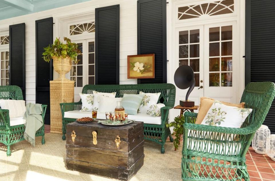 a living room with green chairs