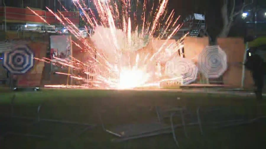 A firework was ignited and thrown into an pro-Palestinian encampment by a pro-Israel protestor at the UCLA campus on April 30, 2024. (KTLA)