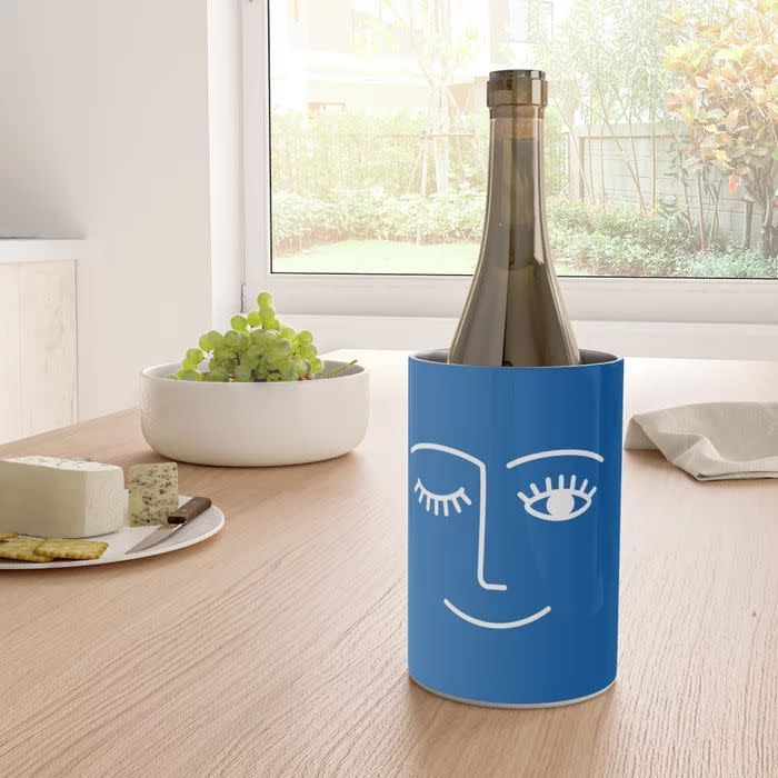 <p><strong>Summer Sun Home Art</strong></p><p>society6.com</p><p><strong>$1.00</strong></p><p>What's cheekier than a chilled bottle of wine on a weekend afternoon? A winking chiller, of course. This is a great gift for the pal who just likes to get everyone together around a nice spread of food and beverage. </p>