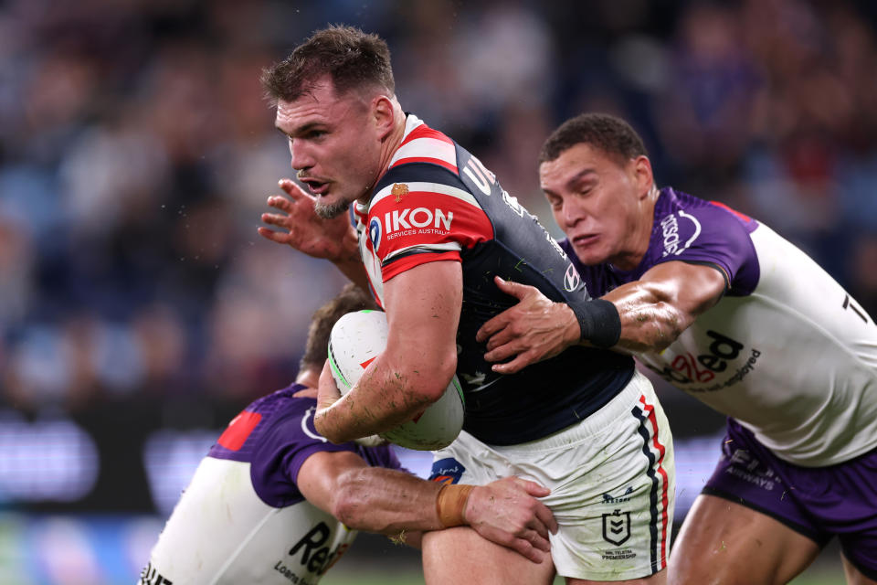 SYDNEY, AUSTRALIA - APRIL 18:  Angus Crichton of the Roosters is tackled during the round seven NRL match between Sydney Roosters and Melbourne Storm at Allianz Stadium on April 18, 2024, in Sydney, Australia. (Photo by Cameron Spencer/Getty Images)